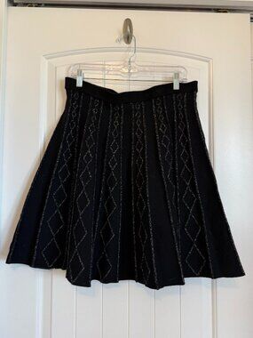 REVERSIBLE black pleated A-line skirt with a silver diamond geometric pattern